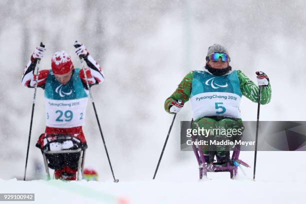Ethan Hess of Canada, left, and Valiantsina Shyts of Belarus ski during Cross Country Skiing training ahead of the PyeongChang 2018 Paralympic Games...