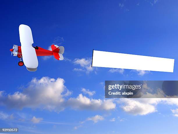 biplane with banner - airplane banner stock pictures, royalty-free photos & images