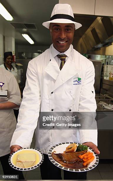 Colin Jackson OBE poses with Britain's favourite school meal at Morpeth School during the Launch of National School Meal Week on November 9, 2009 in...