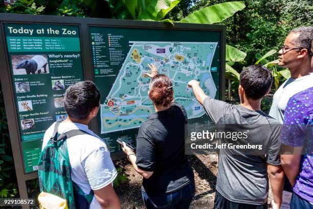 New York City, Bronx Zoo, People looking at map.