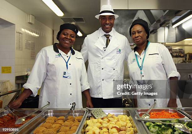Colin Jackson OBE poses with catering staff from Morpeth School at the Launch of National School Meal Week on November 9, 2009 in London, England.
