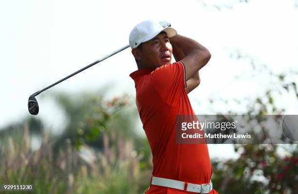 Ashun Wu of China tees off on the 17th hole during day one of the Hero Indian Open at Dlf Golf and Country Club on March 8, 2018 in New Delhi, India.