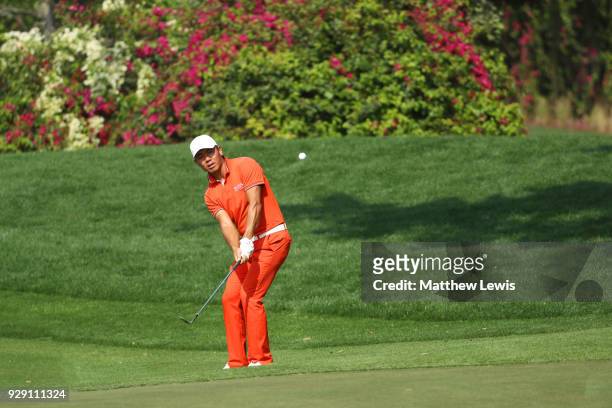 Ashun Wu of China plays his second shot on the 16th hole during day one of the Hero Indian Open at Dlf Golf and Country Club on March 8, 2018 in New...
