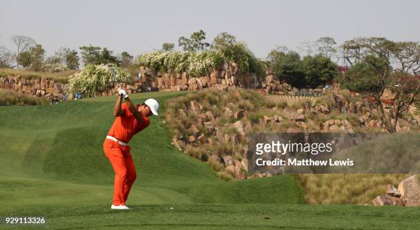 Ashun Wu of China plays his second shot on the 17th hole during day one of the Hero Indian Open at Dlf Golf and Country Club on March 8, 2018 in New...