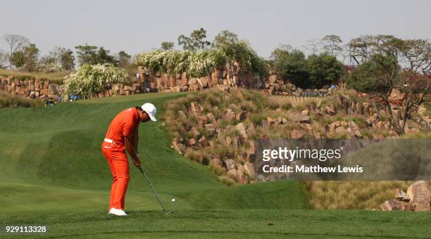 Ashun Wu of China plays his second shot on the 17th hole during day one of the Hero Indian Open at Dlf Golf and Country Club on March 8, 2018 in New...