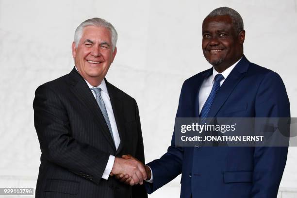 African Union Commission Chairman Moussa Faki , of Chad, and US Secretary of State Rex Tillerson shake hands after their meeting at AU headquarters...