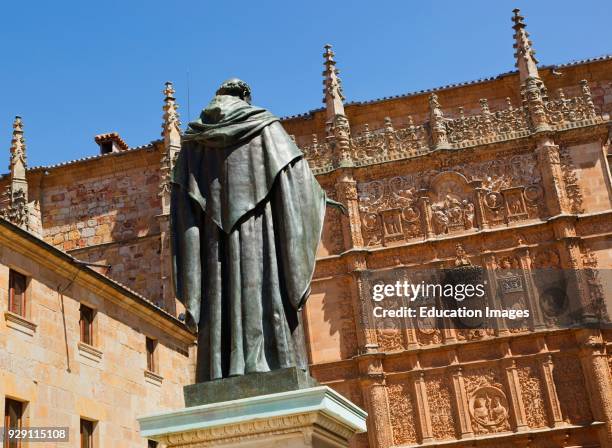 Salamanca, Salamanca Province, Spain. Statue of Augustinian friar Fray Luis Ponce de León 1527 – 1591 by Nicasio Sevilla in front of the 16th century...