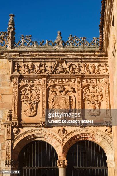Salamanca, Salamanca Province, Spain. University. Imperial shields above the entrance to the Courtyard of the Escuelas Menores. The center shield is...