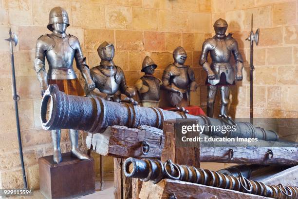 Segovia, Segovia Province, Spain. 14th and 15th century artillery pieces and arms and armor on display in the Armory of the Alcazar.