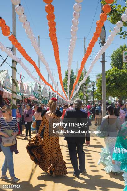 Seville, Seville Province, Andalusia, southern Spain, Feria de Abril, the April Fair, Strolling through the fairground.