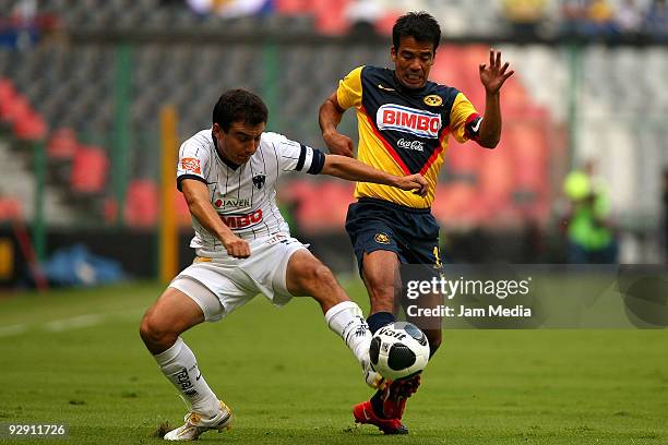 Luis Perez of Rayados de Monterrey vies for the ball with Pavel Pardo of Aguilas del America during their Mexican league Apertura 2009 soccer match...