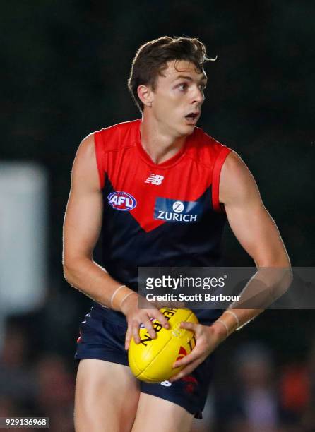Jake Lever of the Demons runs with the ball during the JLT Community Series AFL match between the Melbourne Demons and the St Kilda Saints at Casey...