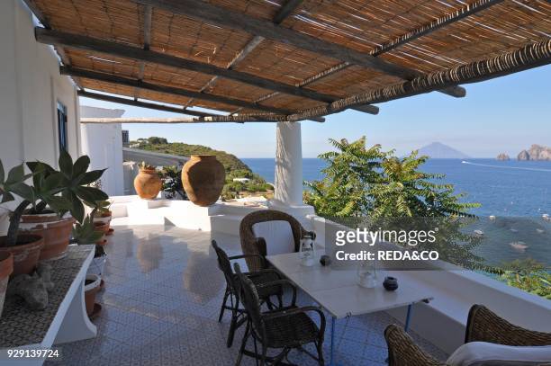 Panarea aeolian terrace and view to Stromboli. Messina. Sicily. Italy. Europe.