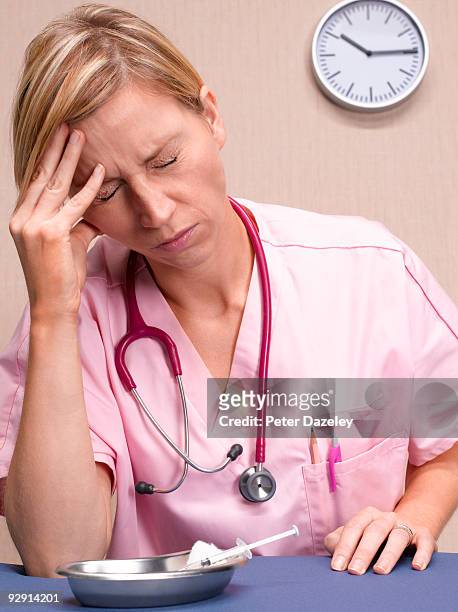 female doctor showing emotional stress. - parsons green stockfoto's en -beelden
