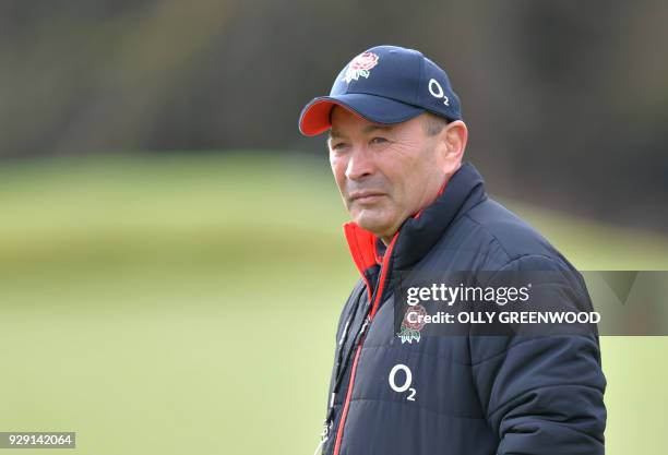 England's coach Eddie Jones takes part in a training session at Pennyhill Park in Bagshot, some 40 miles west of London on March 8, 2018. / AFP PHOTO...