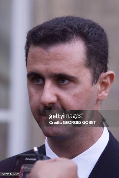 Bashar al-Assad, son of Syrian President Hafez al-Assad answers media 07 November 1999 in the courtyard of the Elysée Palace after his meeting with...