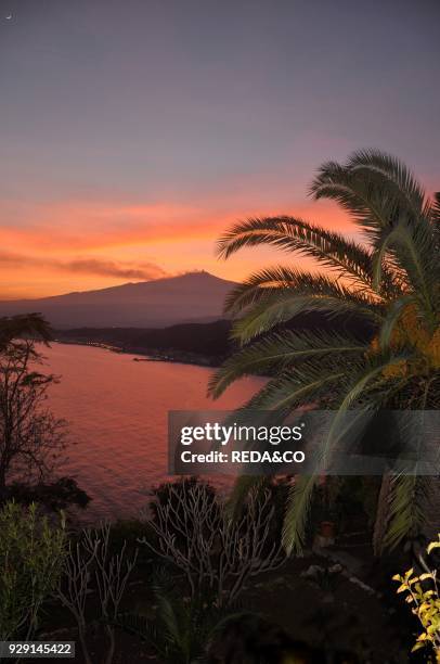 Giadini Naxos Harbor. Taormina sunset. Volcano Etna. Sicily. Italy. Europe.