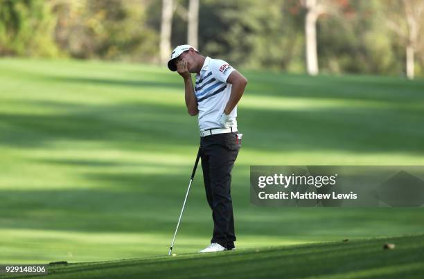 Emiliano Grillo of Argentina reacts after his third shot on the 15th hole during day one of the Hero Indian Open at Dlf Golf and Country Club on...