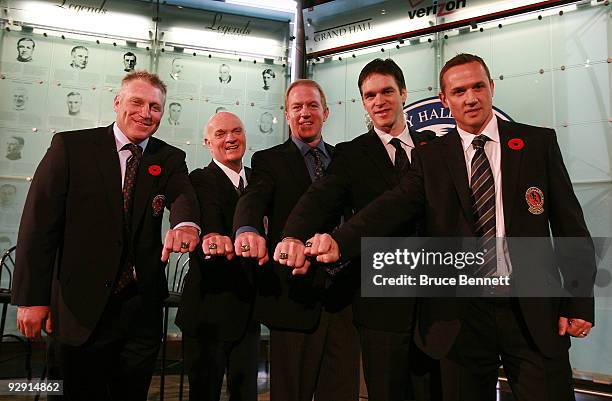 Brett Hull, Lou Lamoriello, Brian Leetch, Luc Robitaille, and Steve Yzerman pose with their Hall rings at the Hockey Hall of Fame Induction Photo...