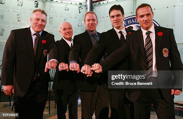 Brett Hull, Lou Lamoriello, Brian Leetch, Luc Robitaille, and Steve Yzerman pose with their Hall rings at the Hockey Hall of Fame Induction Photo...
