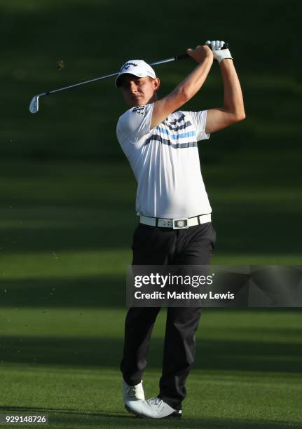 Emiliano Grillo of Argentina plays his second shot on the 15th hole during day one of the Hero Indian Open at Dlf Golf and Country Club on March 8,...