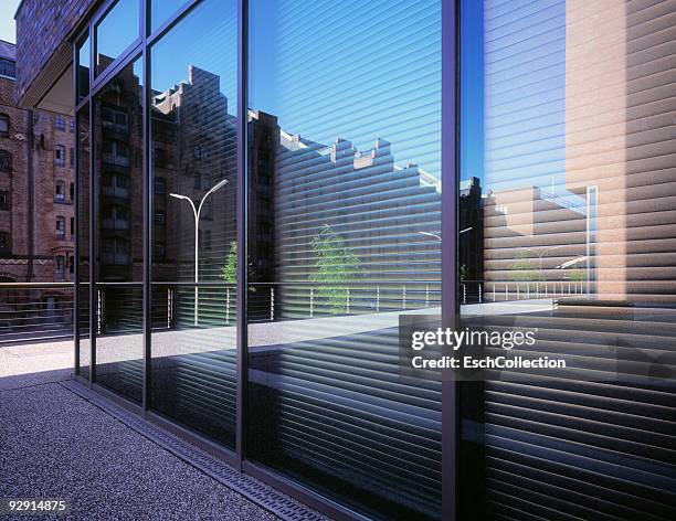 reflection of the renovated speicherstadt. - vertical blinds stock pictures, royalty-free photos & images