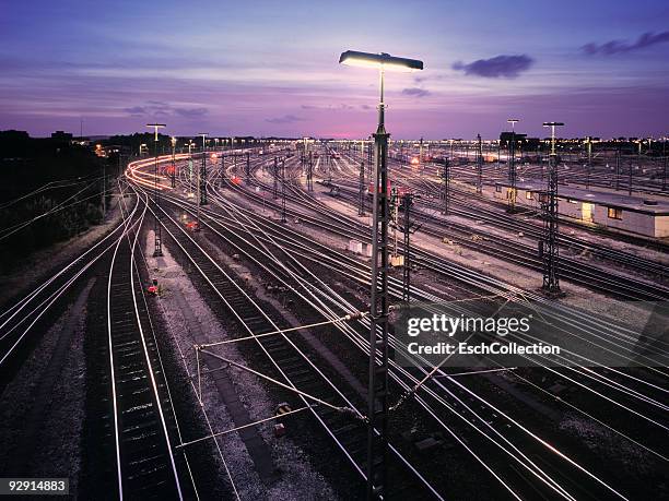 giant marshalling yard at dusk in hamburg. - railroad track bildbanksfoton och bilder
