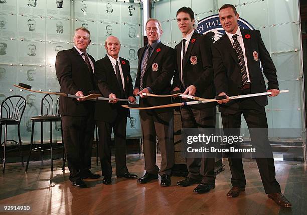 Brett Hull, Lou Lamoriello, Brian Leetch, Luc Robitaille, and Steve Yzerman pose with their Hall rings at the Hockey Hall of Fame Induction Photo...