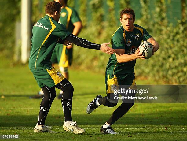 Kurt Gidley beats a tackle from Josh Morris of the VB Kangaroos Australian Rugby League Team in action during a Training Session at Leeds Rugby...
