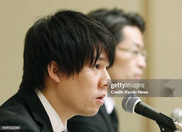 Coincheck Inc. CEO Koichiro Wada holds a press conference in Tokyo on March 8 to explain the company's plan to compensate its customers for the loss...