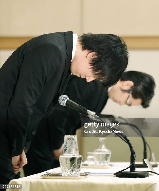 Coincheck Inc. CEO Koichiro Wada apologizes at a press conference held in Tokyo on March 8 to explain the company's plan to compensate its customers...