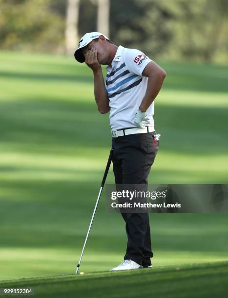 Emiliano Grillo of Argentina reacts after his third shot on the 15th hole during day one of the Hero Indian Open at Dlf Golf and Country Club on...