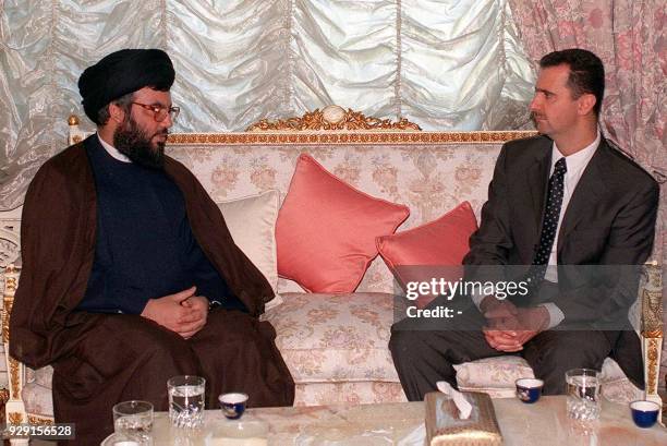 Lebanese Hezbollah leader Sheikh Hassan Nasrallah pays his condolences to Bashar al-Assad, Syrian heir apparent, 12 June 2000 in Damascus. Bashar was...