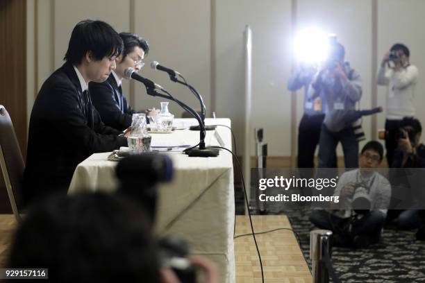 Koichiro Wada, president of Coincheck Inc., left, and Yusuke Otsuka, chief operating officer of Coincheck Inc., attend a news conference in Tokyo,...