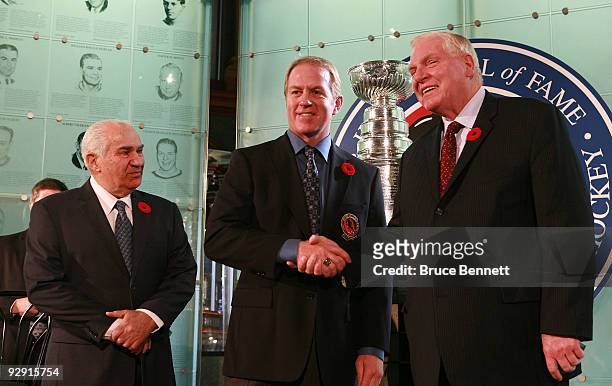 Jim Gregory and Bill Hay present Brian Leetch with his Hall of Fame ring at the Hockey Hall of Fame Induction Photo Opportunity at the Hockey Hall of...