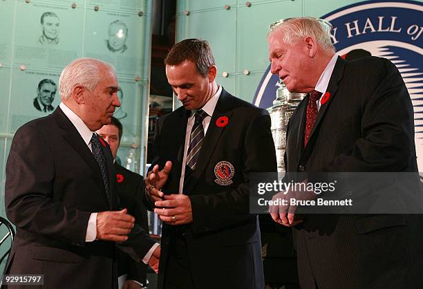 Jim Gregory and Bill Hay present Steve Yzerman with his Hall of Fame ring at the Hockey Hall of Fame Induction Photo Opportunity at the Hockey Hall...