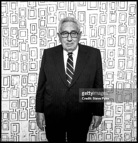Former Secretary of State, Henry Kissinger poses at a portrait session, in front of painting by Jan Frank, in New York on March 14, 2007.