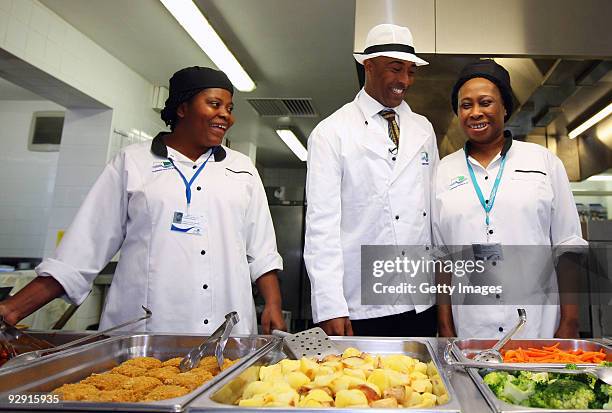 Colin Jackson OBE talks to catering staff from Morpeth School at the Launch of National School Meal Week on November 9, 2009 in London, England.