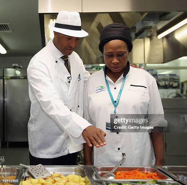 Colin Jackson OBE talks to catering staff from Morpeth School at the Launch of National School Meal Week on November 9, 2009 in London, England.