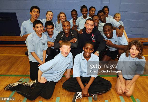 Colin Jackson OBE poses with pupils from Morpeth School during the Launch of National School Meal Week on November 9, 2009 in London, England.