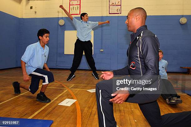 Colin Jackson OBE demonstrates some exercises in a Get Active workout at Morpeth School during the Launch of National School Meal Week on November 9,...