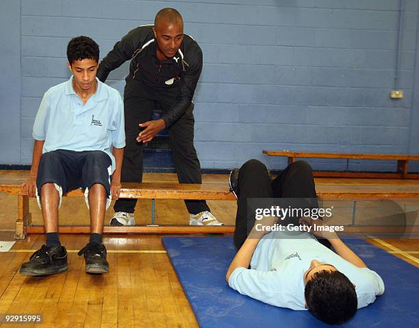 Colin Jackson OBE demonstrates some exercises in a Get Active workout at Morpeth School during the Launch of National School Meal Week on November 9,...