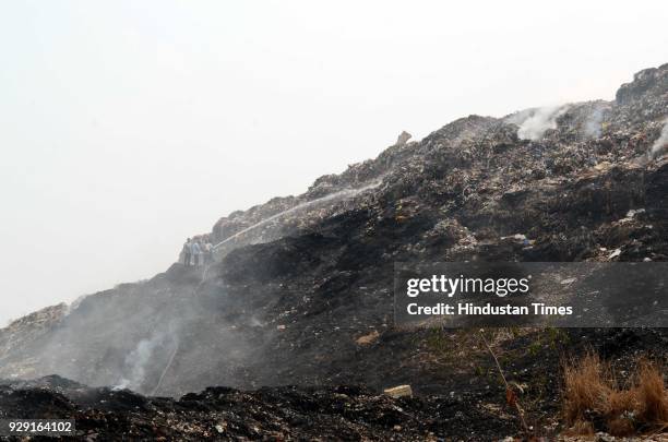 Major fire broke out at the Adharwadi dumping ground in Kalyan, on March 7, 2018 in Mumbai, India. Thick, black smoke continued to billow out of...