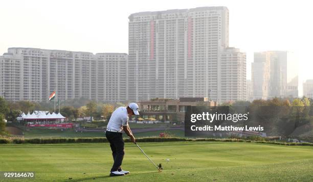 Emiliano Grillo of Argentina plays his second shot on the 18th hole during day one of the Hero Indian Open at Dlf Golf and Country Club on March 8,...