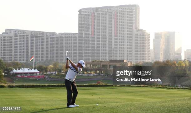 Emiliano Grillo of Argentina plays his second shot on the 18th hole during day one of the Hero Indian Open at Dlf Golf and Country Club on March 8,...