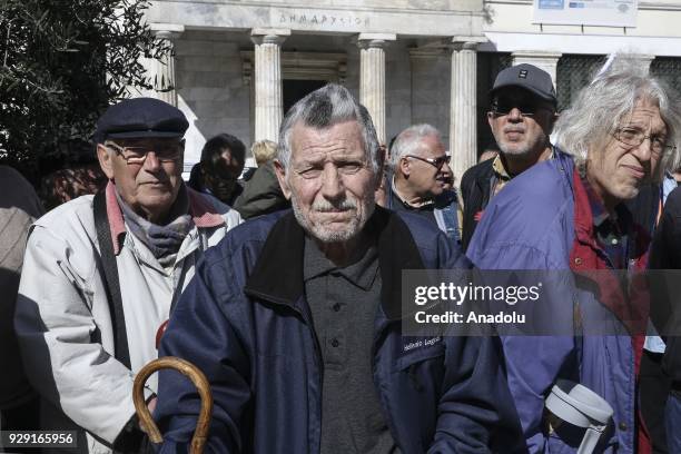 Greek retirees gather at Kotzia Square during a protest against pay cuts as they march to The Ministry of Labour, Social Insurance and Social...