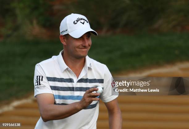 Emiliano Grillo of Argentina acknowledges the crowd on the 18th green during day one of the Hero Indian Open at Dlf Golf and Country Club on March 8,...