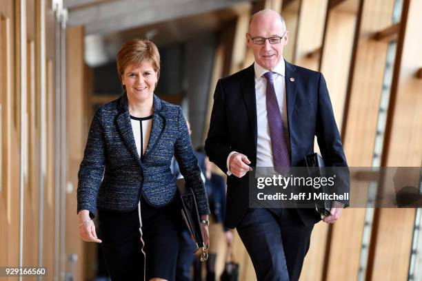 First Minister of Scotland Nicola Sturgeon and deputy First Minister John Swinney arrive for first minister's questions in the Scottish Parliament on...