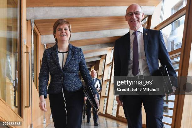 First Minister of Scotland Nicola Sturgeon and deputy First Minister John Swinney arrive for first minister's questions in the Scottish Parliament on...