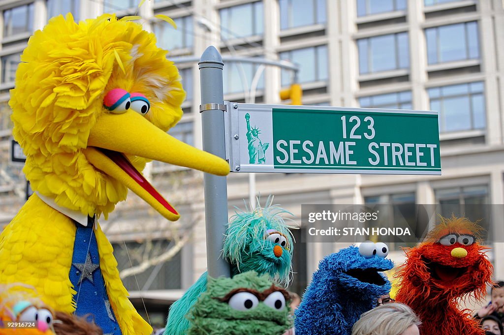 Big Bird (L) and other Sesame Street pup